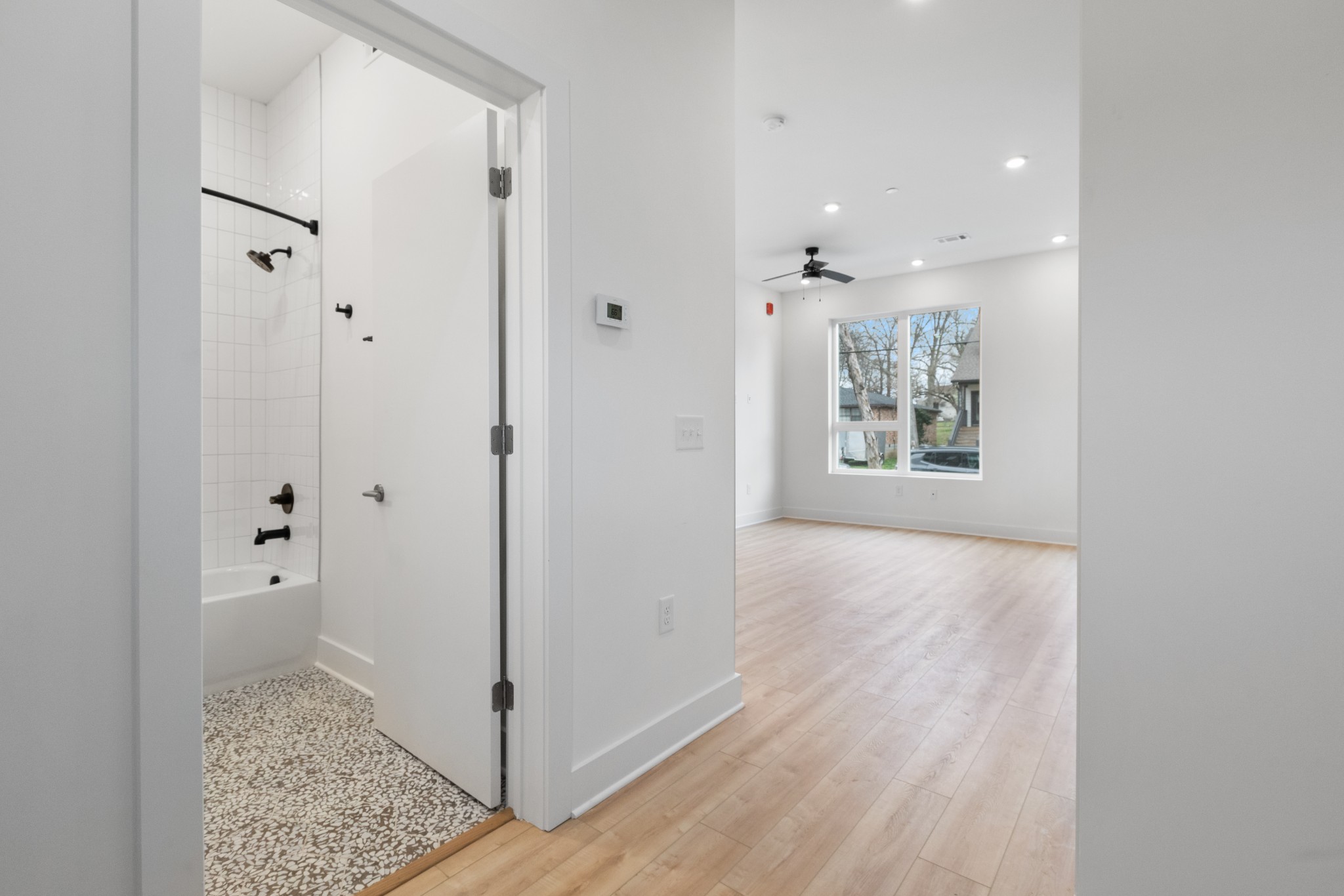 1310 Lischey Avenue, Unit 104 Nashville, TN 37207 - Photo 12 of 28 a view of a hallway with wooden floor and a bathroom