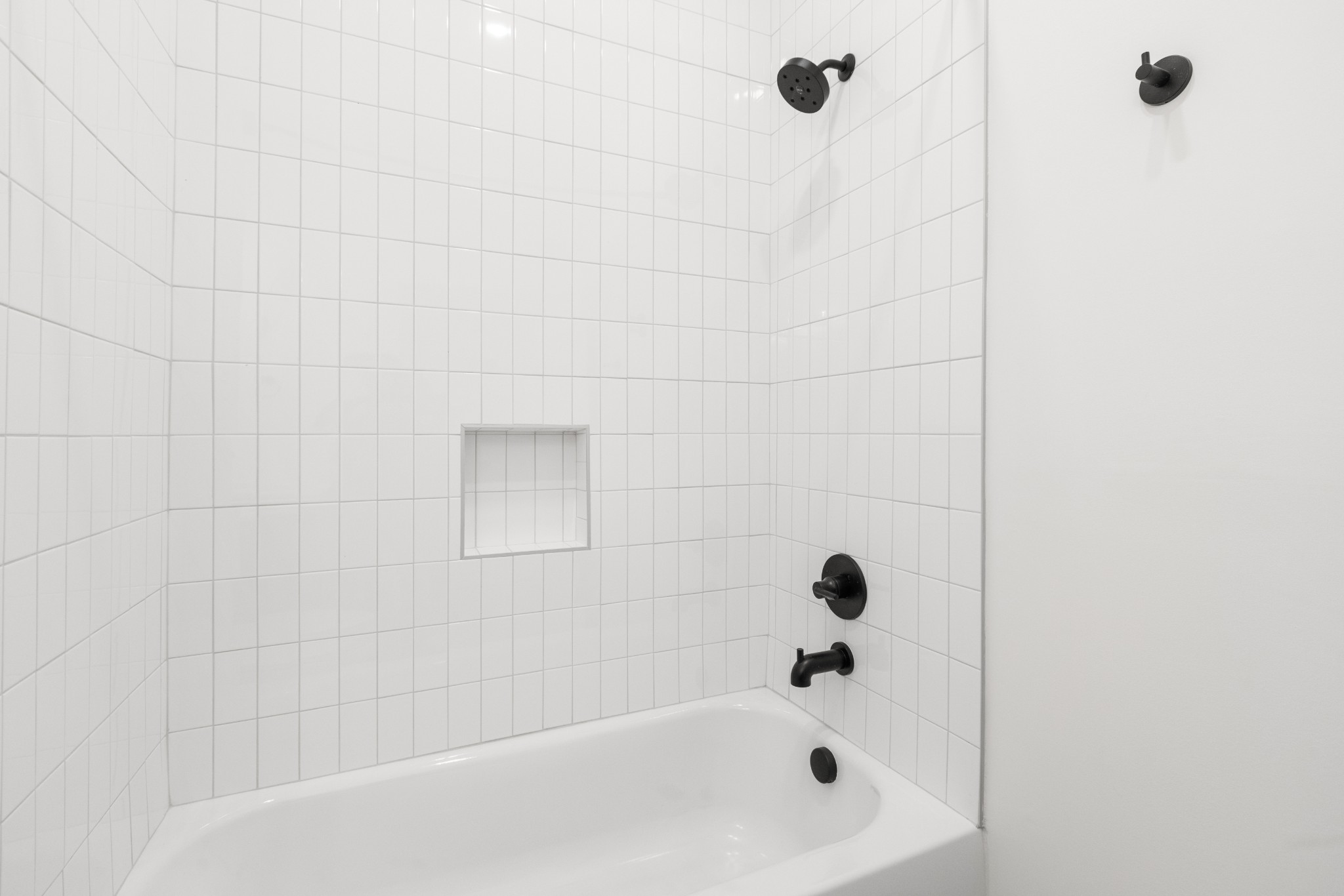 1310 Lischey Avenue, Unit 104 Nashville, TN 37207 - Photo 14 of 28 a bathroom with a bathtub