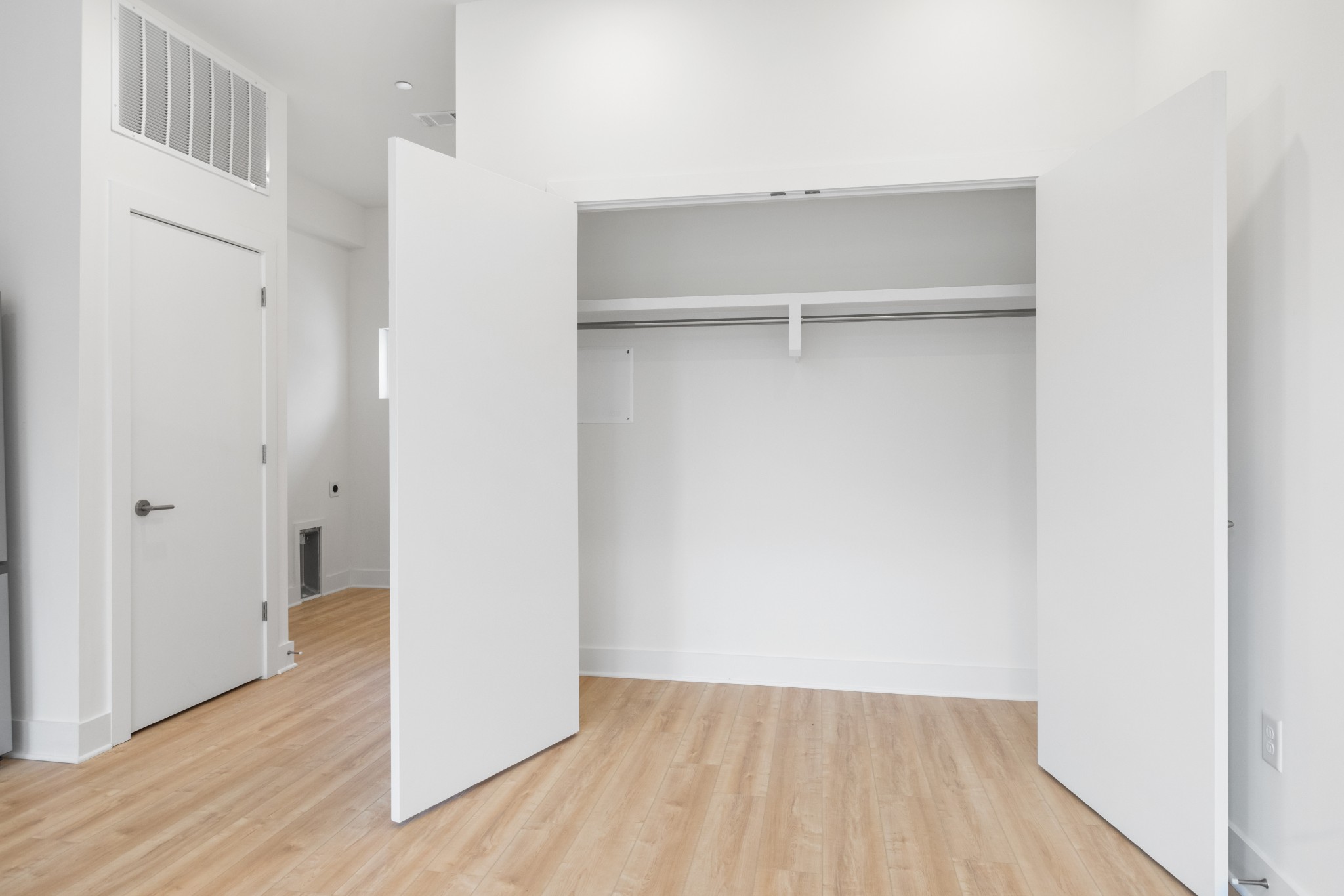 1310 Lischey Avenue, Unit 104 Nashville, TN 37207 - Photo 15 of 28 a view of an empty walk in closet with wooden floor