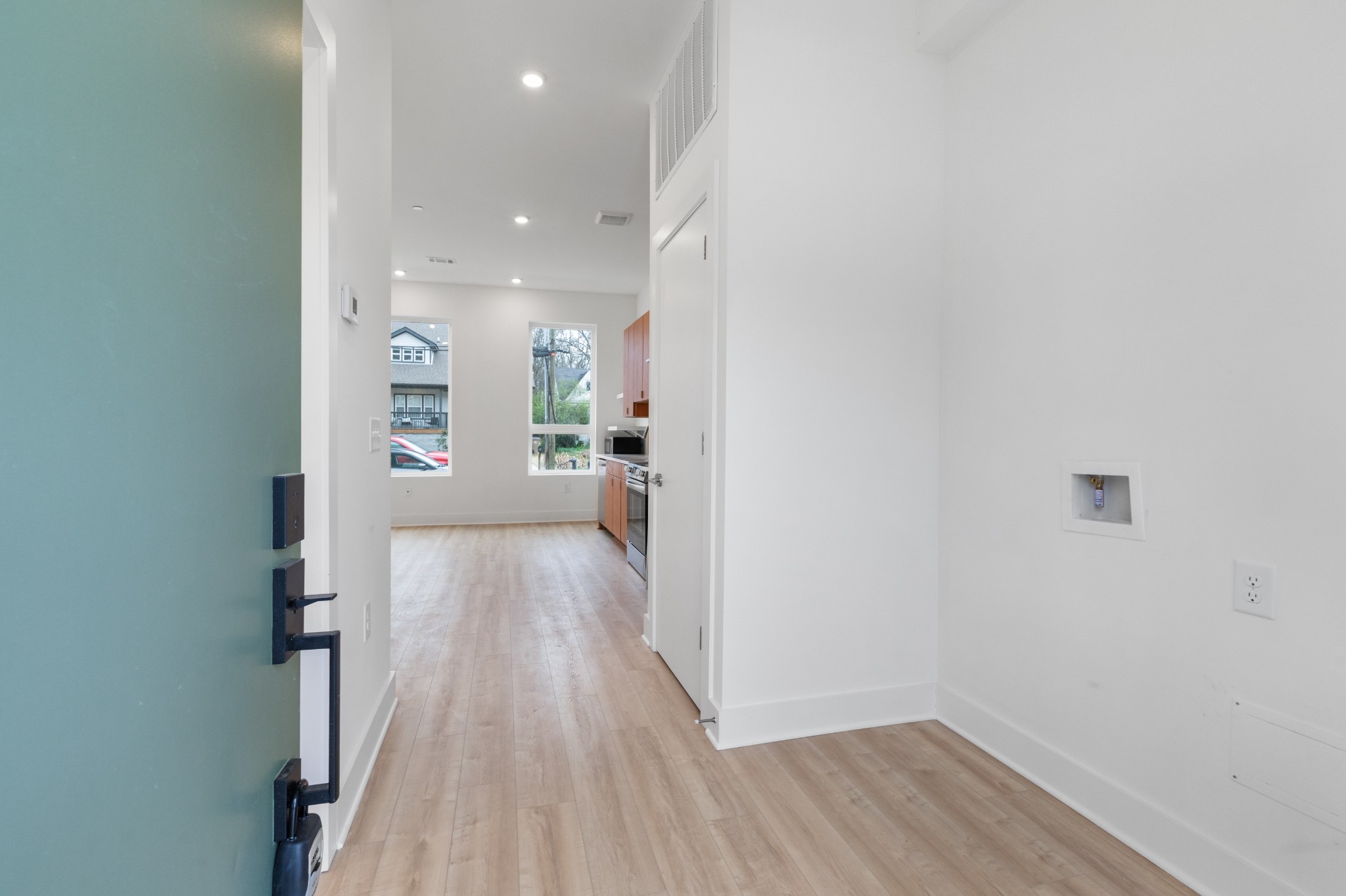 1310 Lischey Avenue, Unit 104 Nashville, TN 37207 - Photo 5 of 28 a view of a hallway with wooden floor and a living room