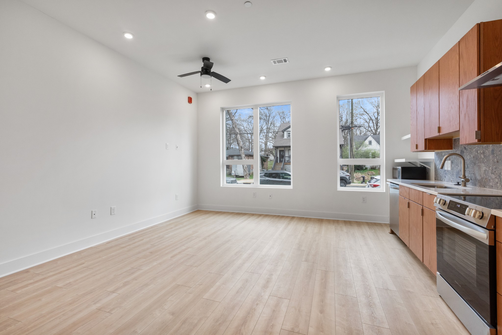 1310 Lischey Avenue, Unit 104 Nashville, TN 37207 - Photo 6 of 28 a view of kitchen with wooden floor electronic appliances and window