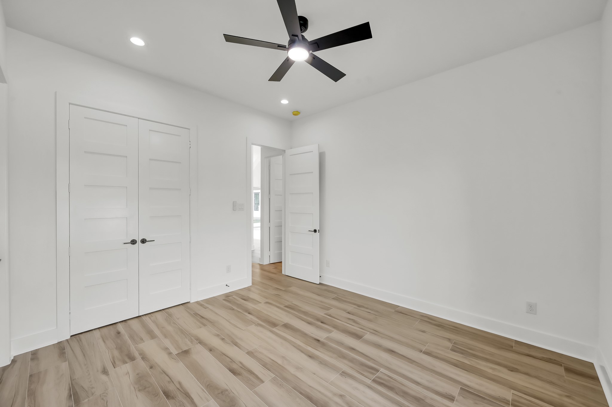 14742 Turquoise Trail Willis, TX 77378 - Photo 30 of 48 Additional bedroom offering generous floor space, double closet doors, and clean modern finishes consistent throughout the home.