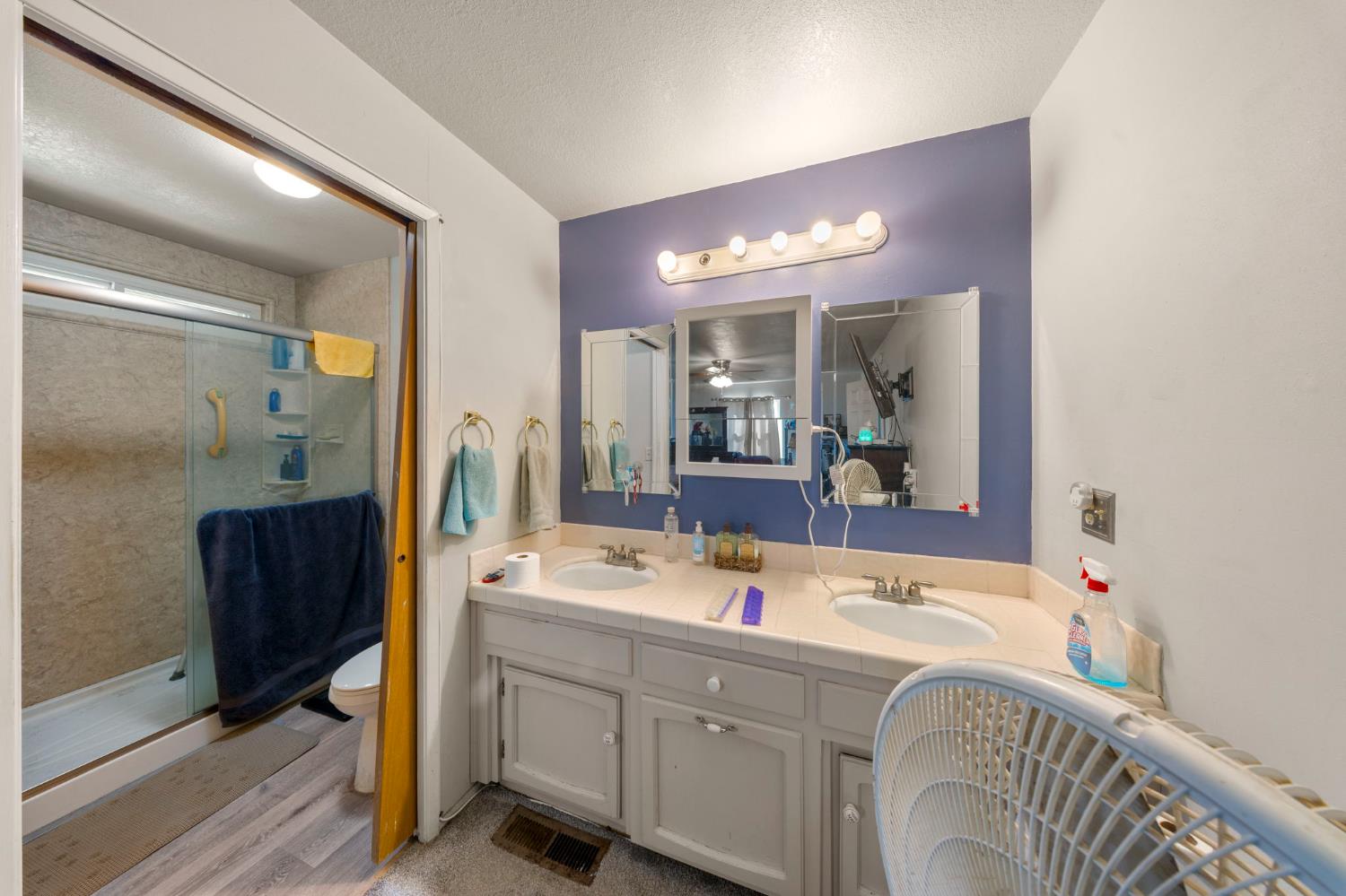 2779 Story Avenue Merced, CA 95340 - Photo 19 of 27 a bathroom with a tub sink and mirror