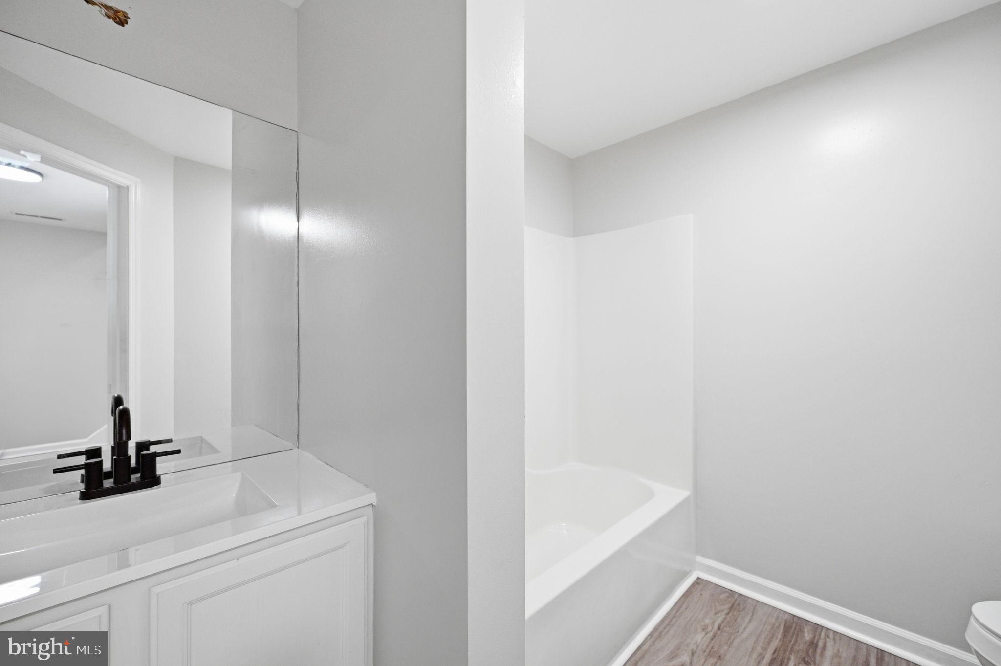 672 Ripplebrook Drive Culpeper, VA 22701 - Photo 7 of 26 Sleek bathroom with modern finishes.