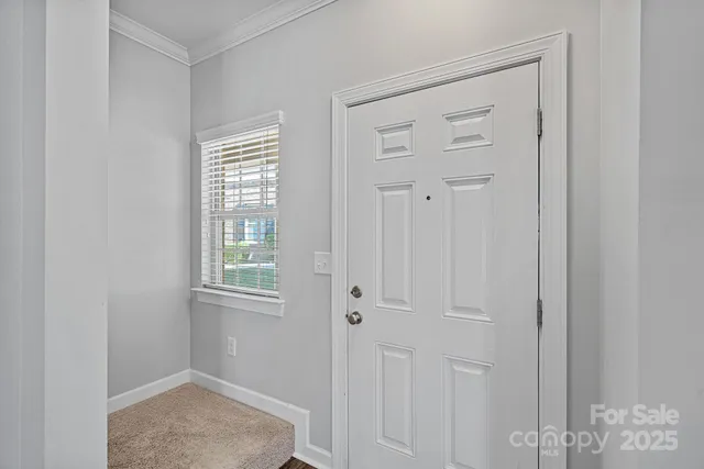 a view of an empty room with windows