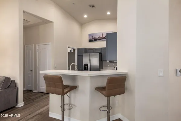 a view of kitchen with cabinets