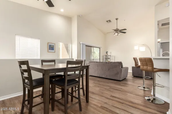a view of a dining room with furniture and wooden floor