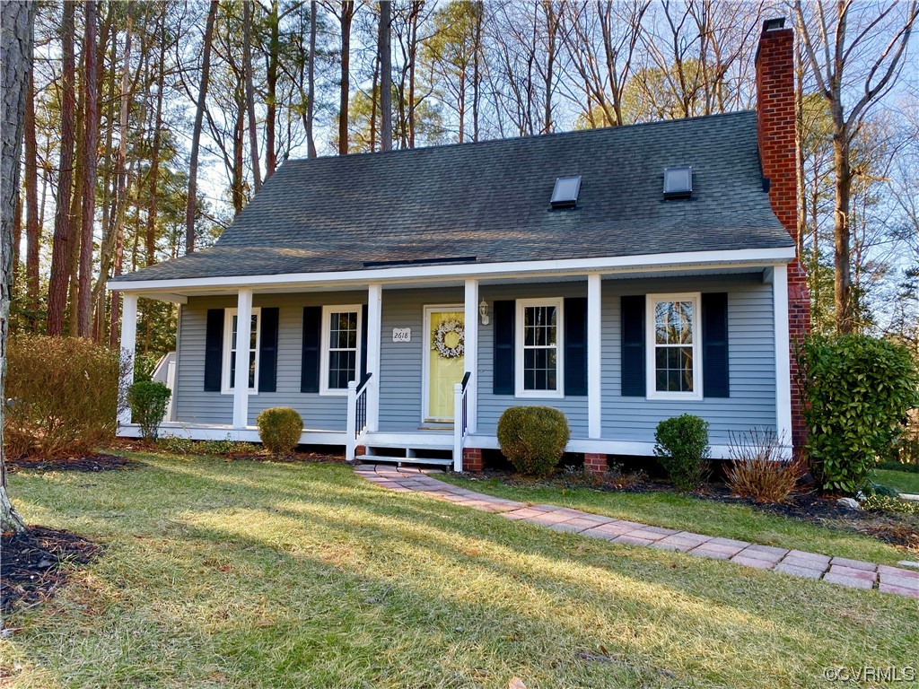 2618 Iverson Road Midlothian, VA 23112 - Photo 1 of 50 a front view of a house with a garden and porch