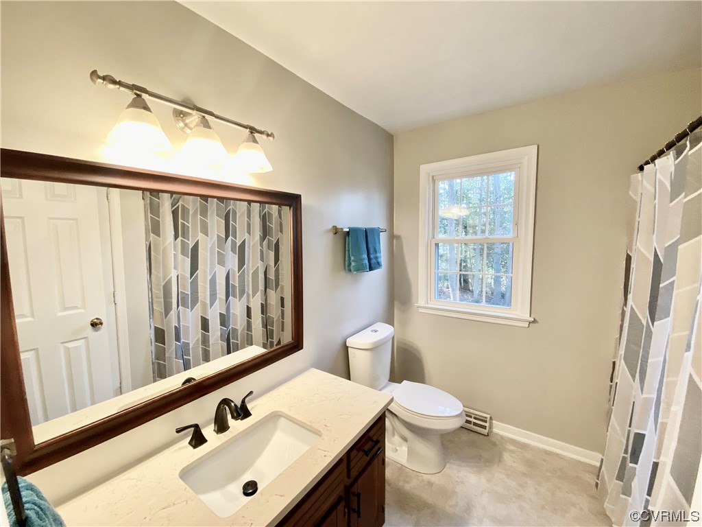 2618 Iverson Road Midlothian, VA 23112 - Photo 26 of 50 a bathroom with a sink and a mirror