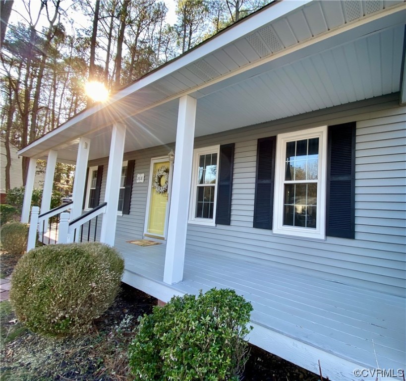 2618 Iverson Road Midlothian, VA 23112 - Photo 4 of 50 a view of a house with a small yard plants and large tree