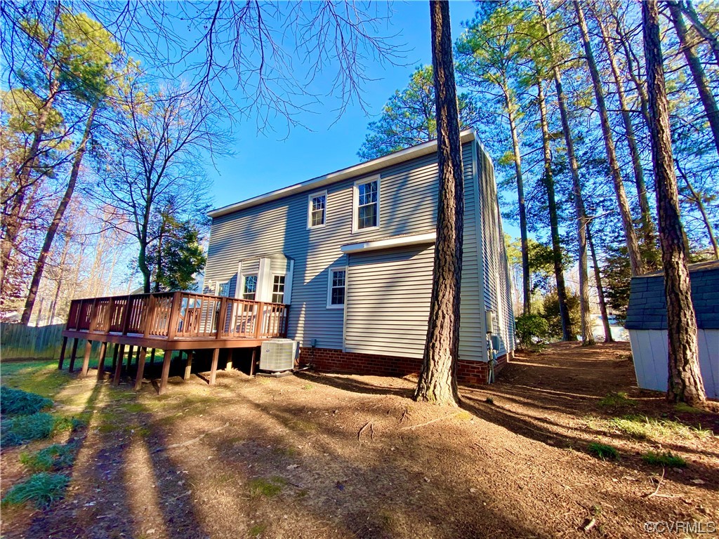 2618 Iverson Road Midlothian, VA 23112 - Photo 46 of 50 a backyard of a house with barbeque oven table and chairs