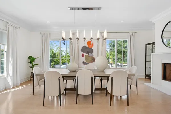 a dining room filled with furniture and window