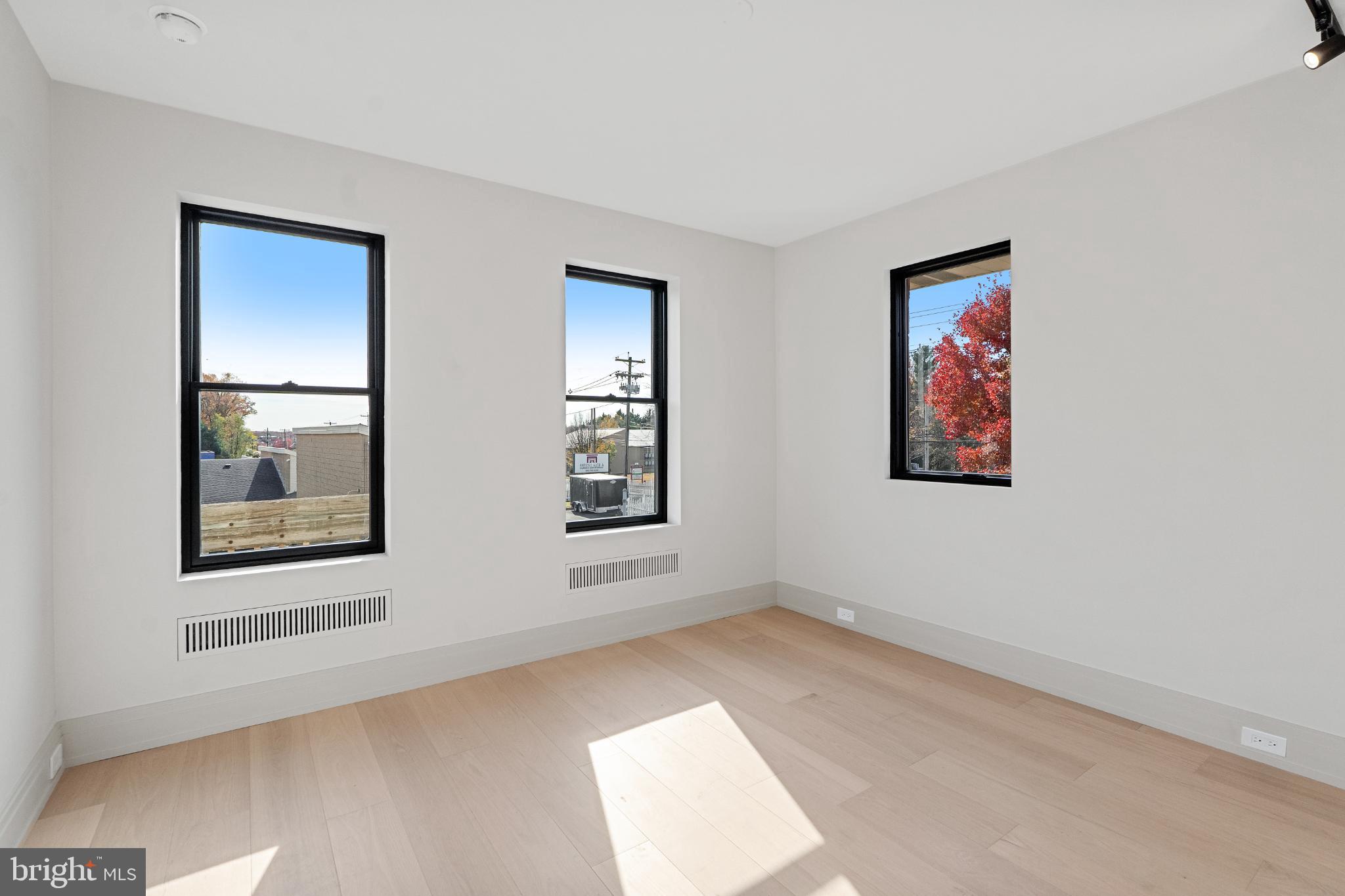 501 Haddonfield-Berlin Road, Unit 2 Voorhees, NJ 08043 - Photo 11 of 18 an empty room with windows and closet