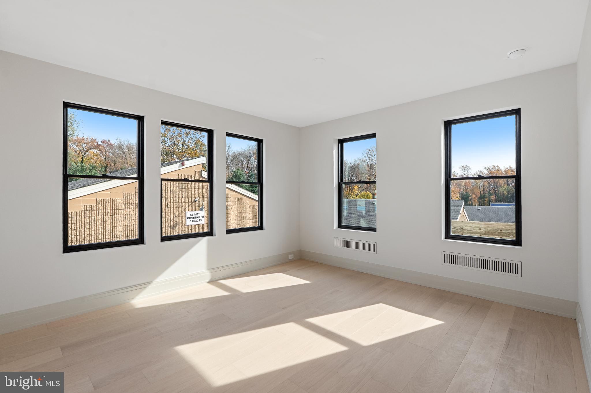 501 Haddonfield-Berlin Road, Unit 2 Voorhees, NJ 08043 - Photo 14 of 18 an empty room with windows and closet