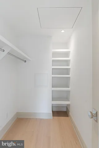 a bathroom with a sink a mirror and shower