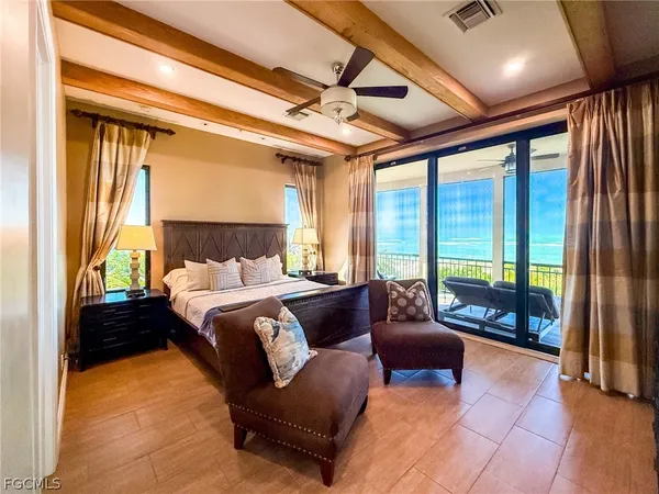 a spacious bedroom with a bed and a couch