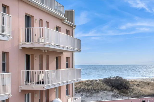 a living room with furniture and flowers