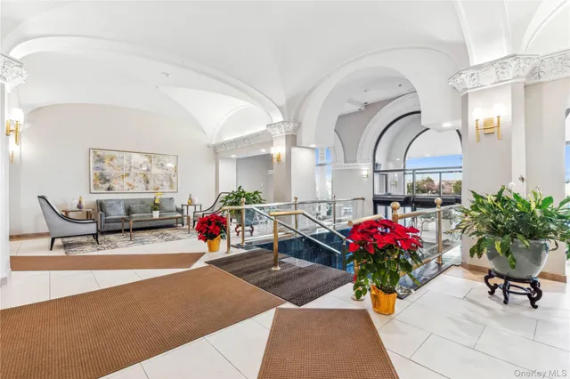 a view of a swimming pool with seating space