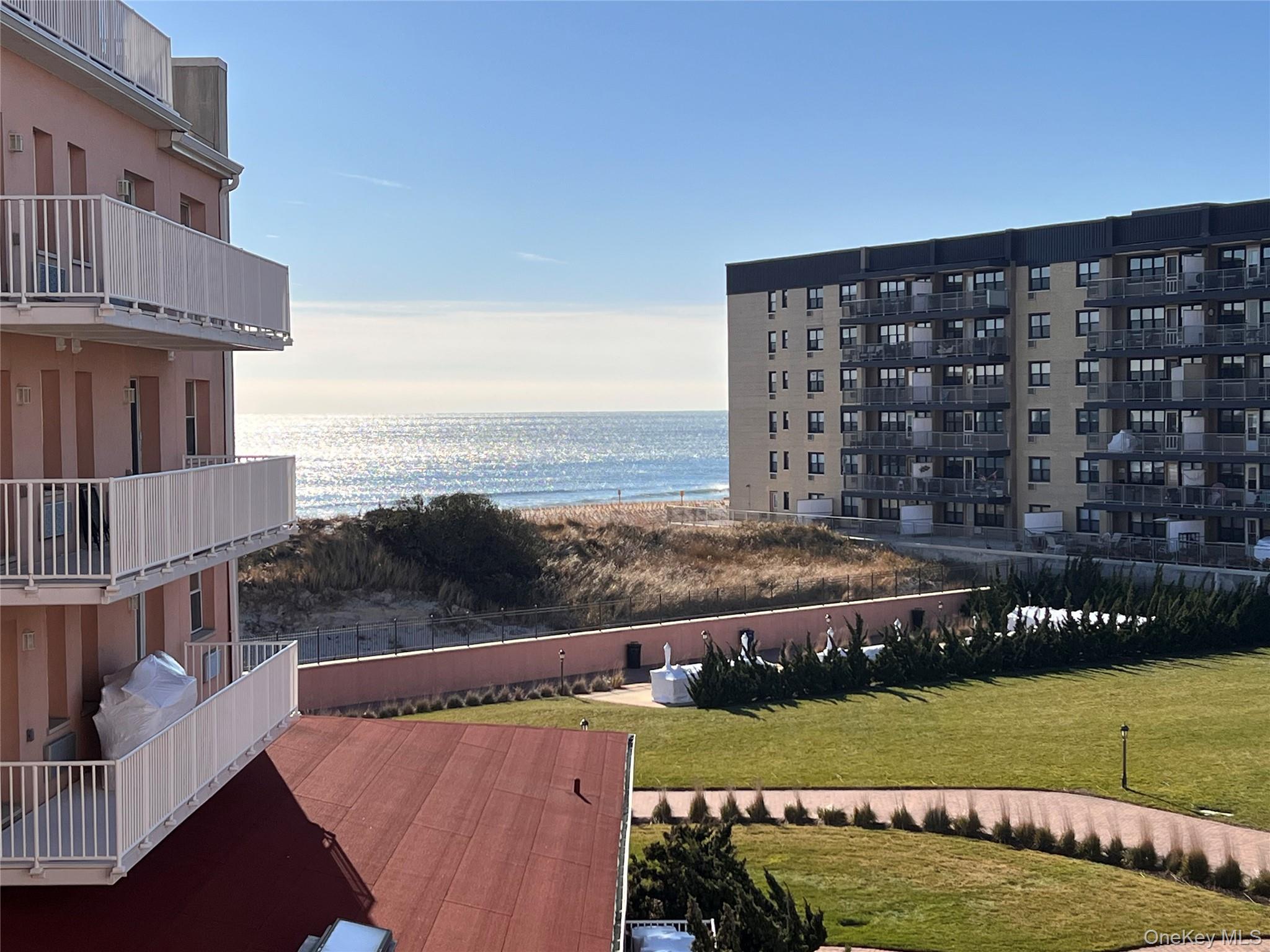 2 Richmond Road, Unit 4V Lido Beach, NY 11561 - Photo 23 of 24 a view of a swimming pool with seating space