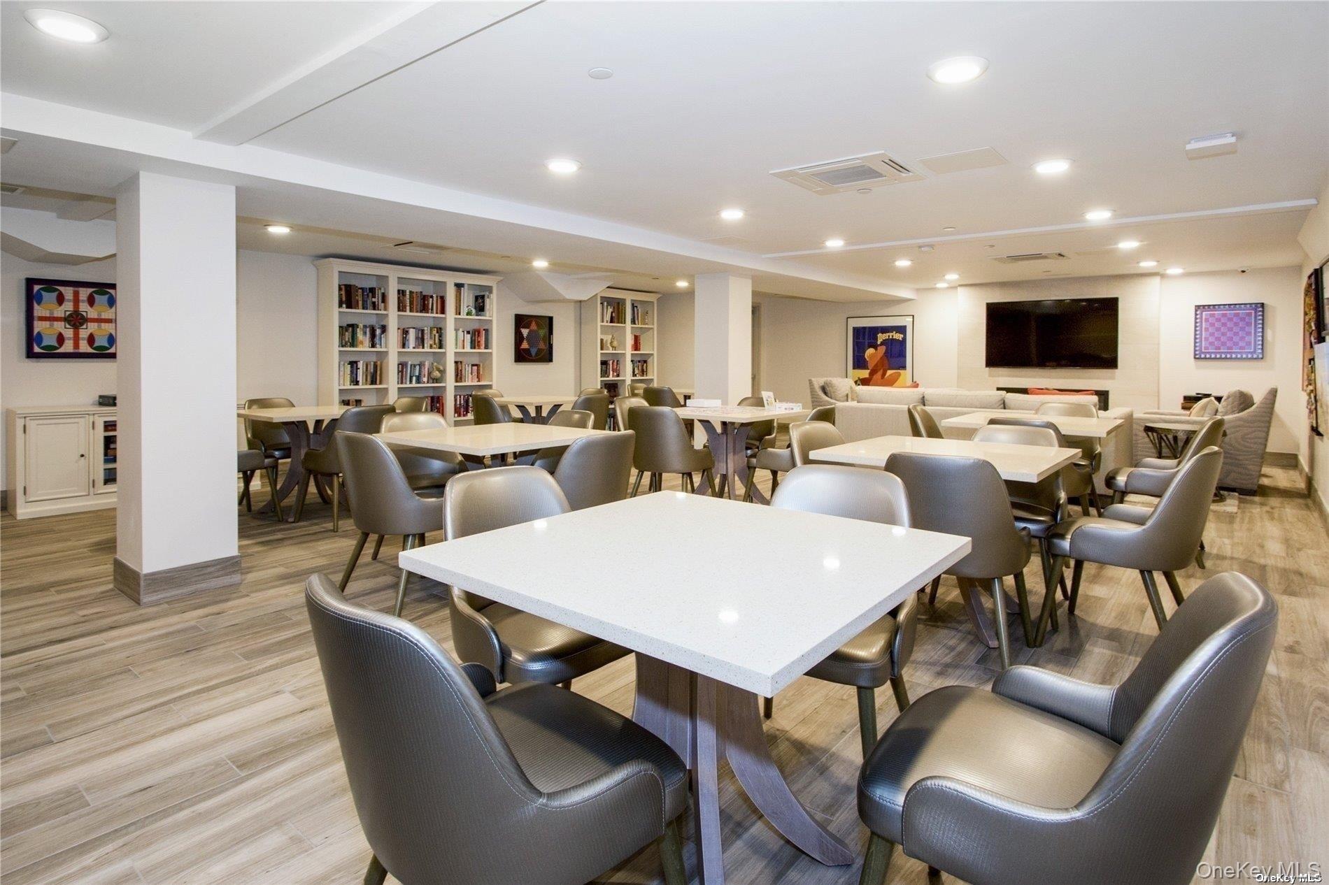 2 Richmond Road, Unit 4V Lido Beach, NY 11561 - Photo 6 of 24 a view of a dining room with furniture