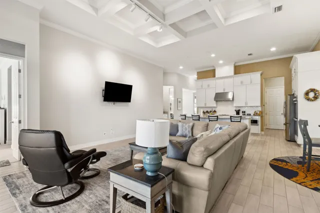 a kitchen with granite countertop a sink stainless steel appliances and cabinets