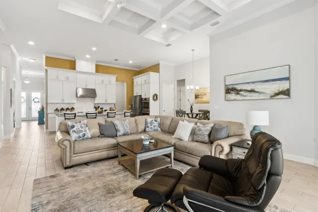 a kitchen with stainless steel appliances kitchen island granite countertop a refrigerator and a stove top oven