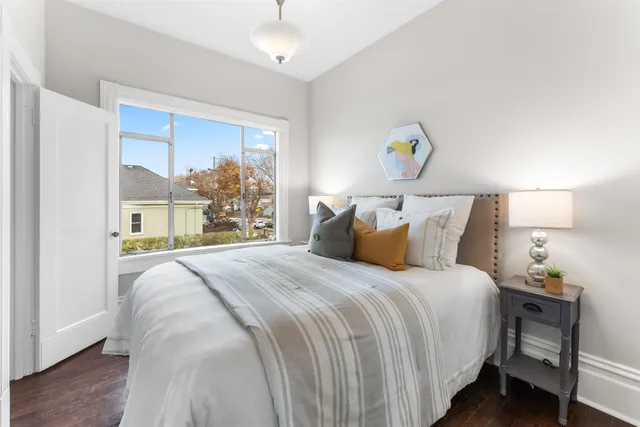 a bedroom with bed and window