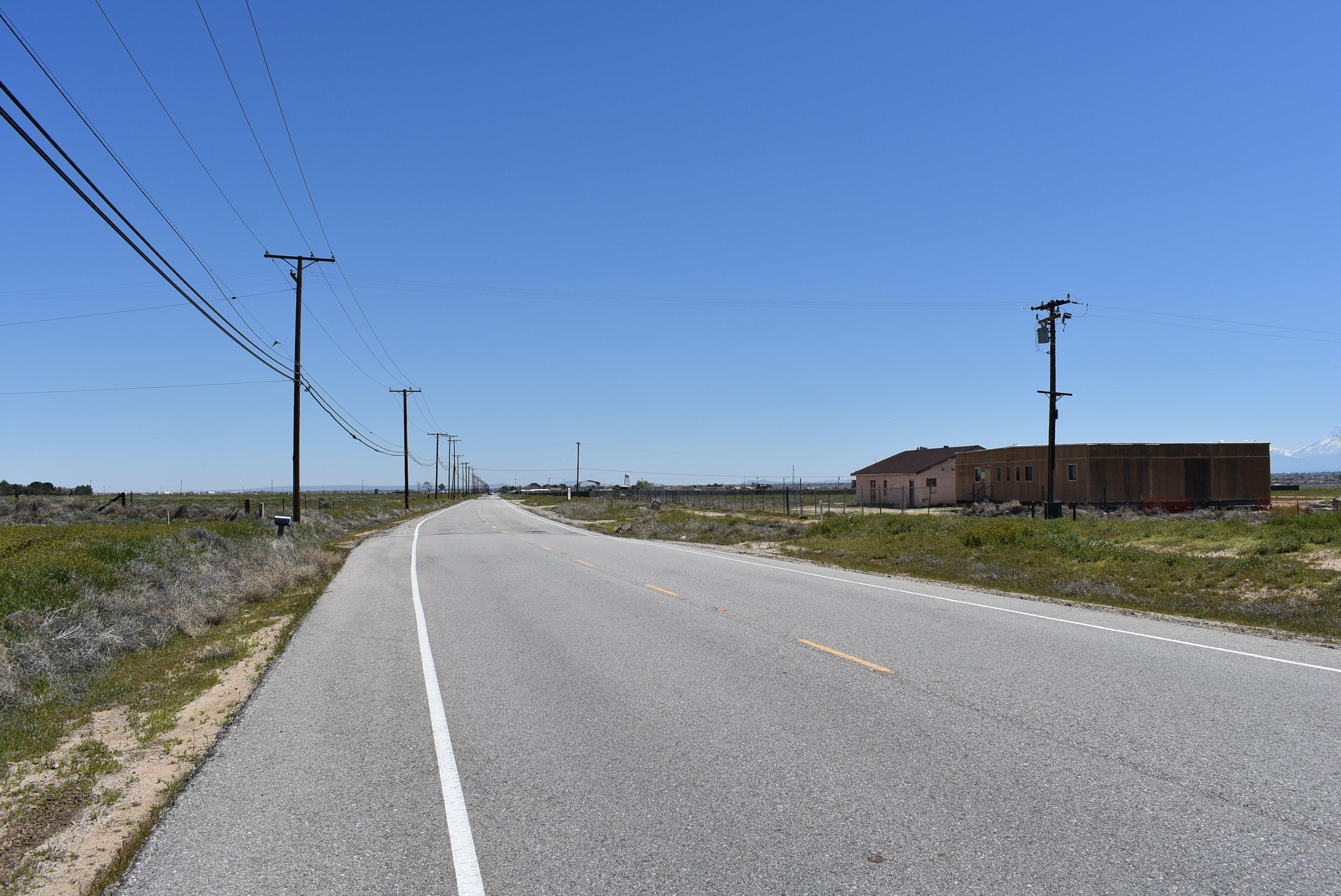 75 Stw Lancaster, CA 93536 - Photo 3 of 11 a view of a city street with a yard