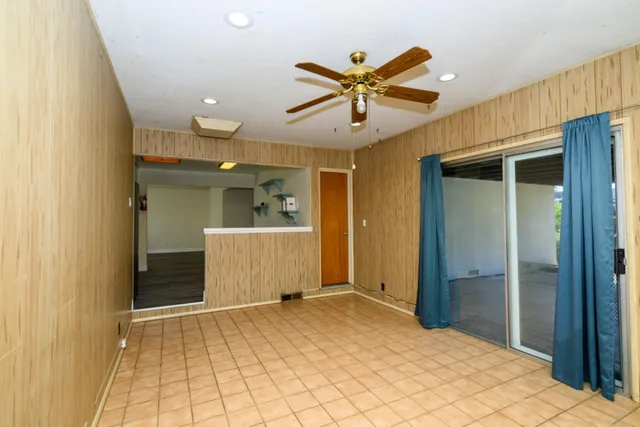 a view of a hallway with a chandelier