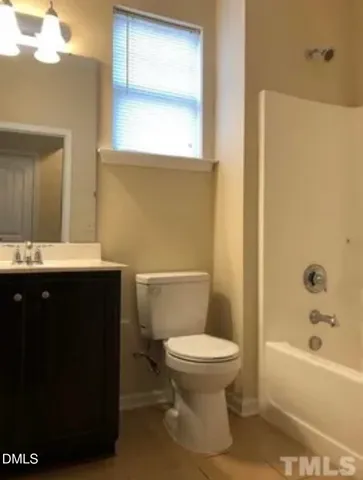 a bathroom with a sink a toilet and bathtub