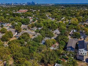 519 Sunnyside Street Cockrell Hill, TX 75211 - Photo 23 of 25 an aerial view of residential house with outdoor space and trees all around
