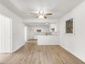 519 Sunnyside Street Cockrell Hill, TX 75211 - Photo 7 of 25 a view of kitchen with wooden floor and window