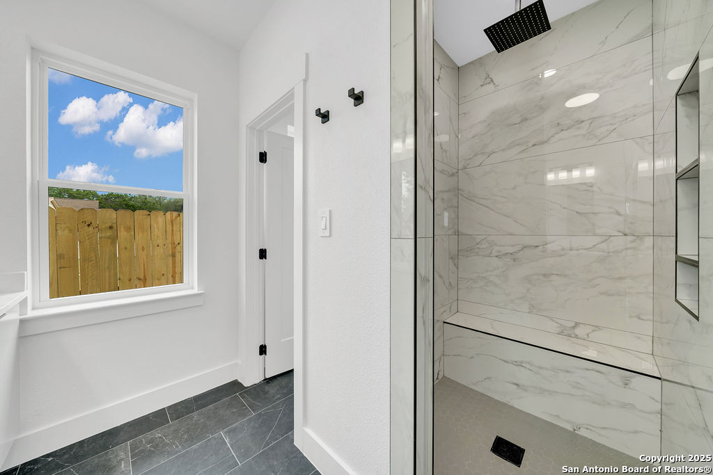 661 Jonquil Drive Spring Branch, TX 78070 - Photo 15 of 18 a bathroom with a bathtub and a shower