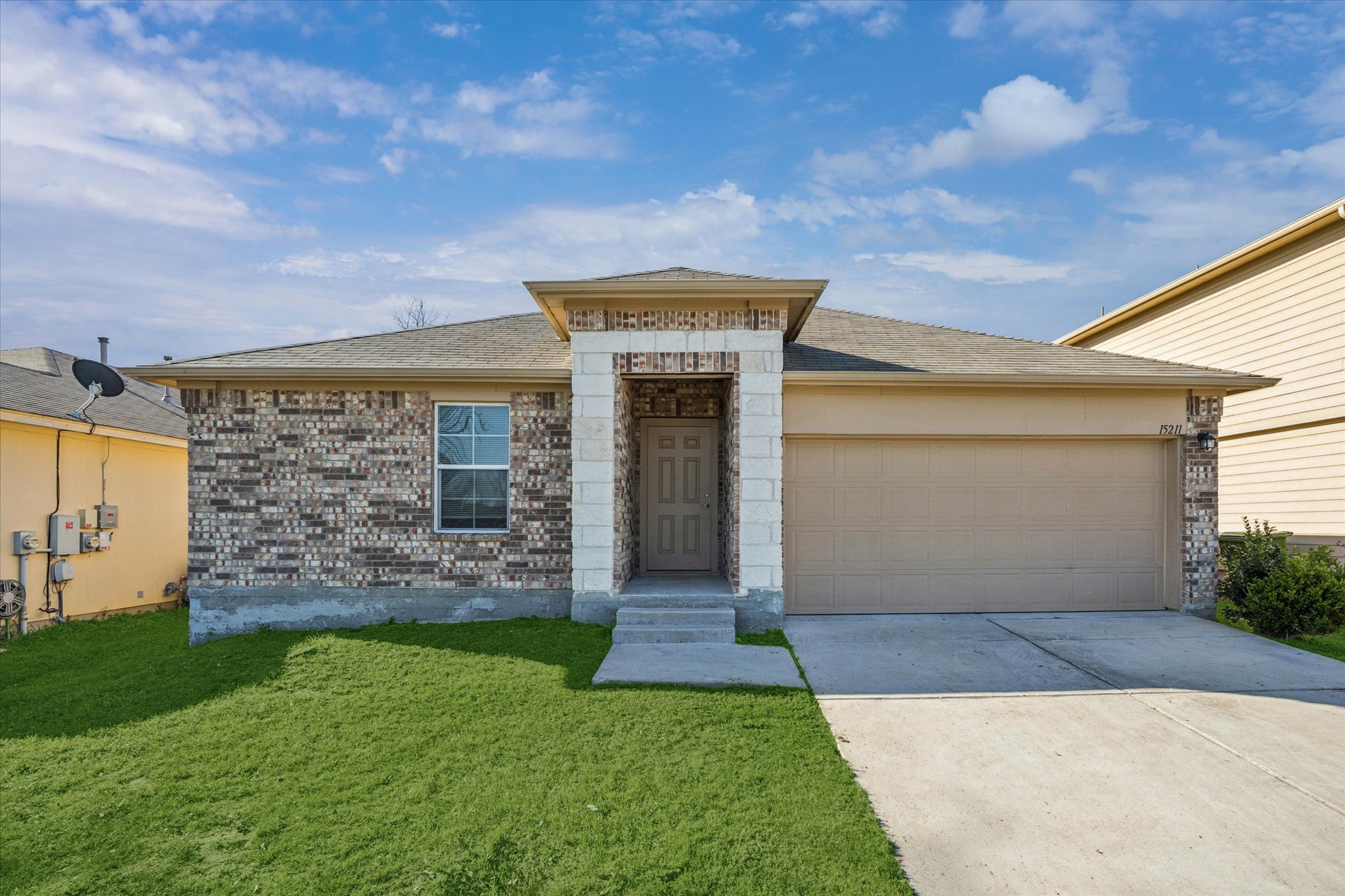 front view of a house with a yard
