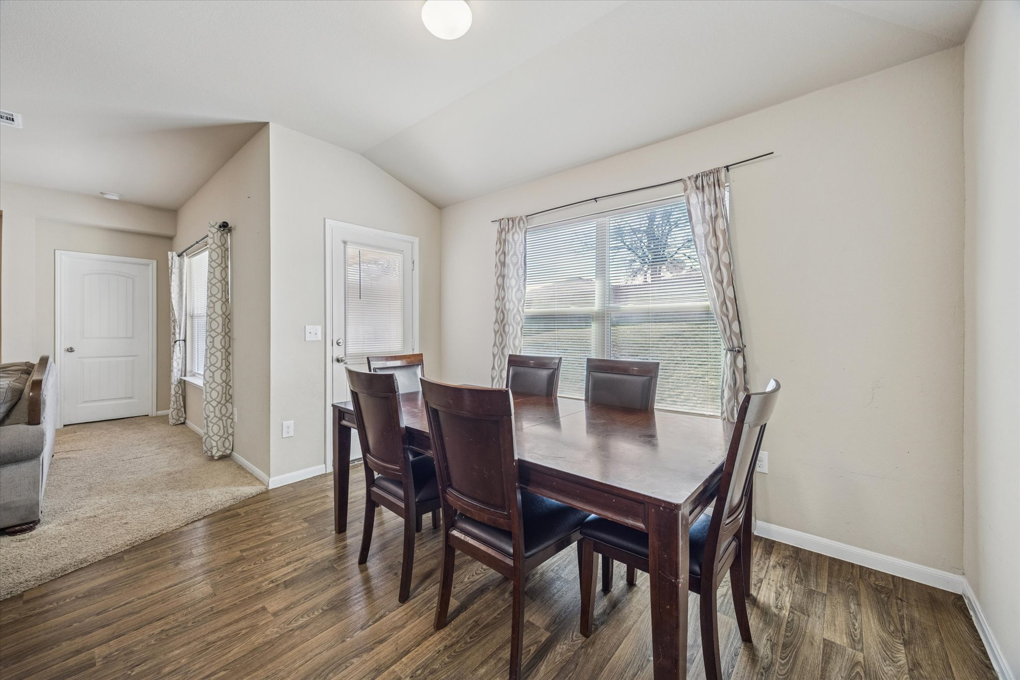 15211 Wideleaf Cove Austin, TX 78724 - Photo 8 of 15 a view of a dining room with furniture and wooden floor