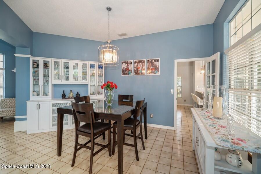 4395 Canard Road Melbourne, FL 32934 - Photo 11 of 36 a view of a dining room with furniture window and outside view
