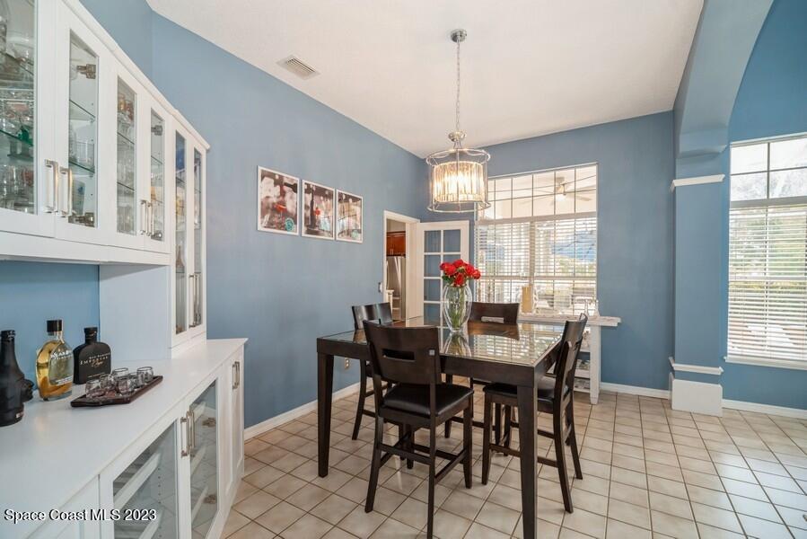 4395 Canard Road Melbourne, FL 32934 - Photo 12 of 36 a view of a dining room with furniture window and outside view