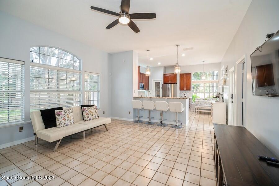 4395 Canard Road Melbourne, FL 32934 - Photo 14 of 36 a living room with furniture and a flat screen tv