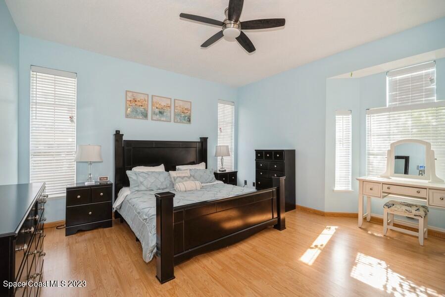 4395 Canard Road Melbourne, FL 32934 - Photo 15 of 36 a bedroom with a bed and a table
