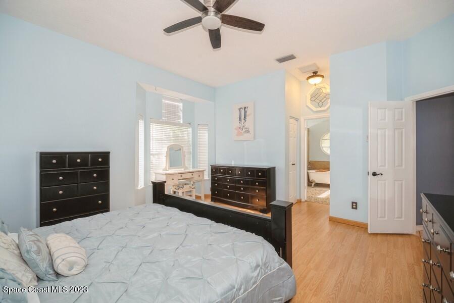 4395 Canard Road Melbourne, FL 32934 - Photo 16 of 36 a bedroom with a bed and a window