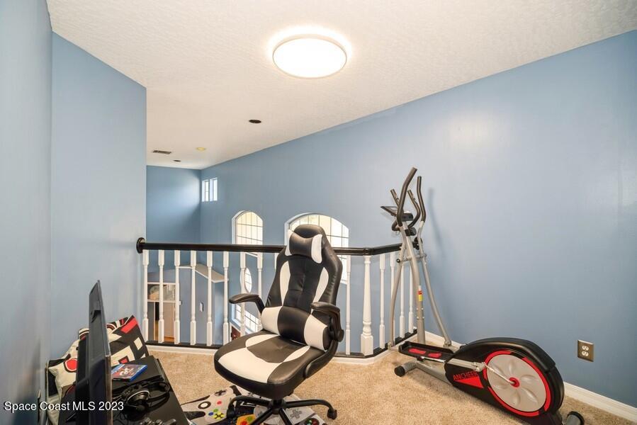 4395 Canard Road Melbourne, FL 32934 - Photo 22 of 36 a view of a room with gym equipment