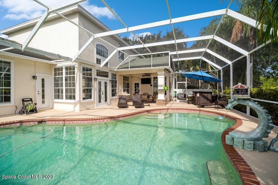 4395 Canard Road Melbourne, FL 32934 - Photo 31 of 36 a view of a house with swimming pool and sitting area