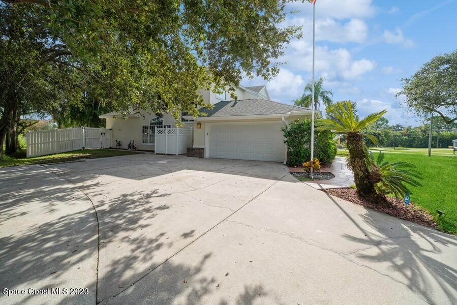 4395 Canard Road Melbourne, FL 32934 - Photo 33 of 36 a view of a house with a yard and tree