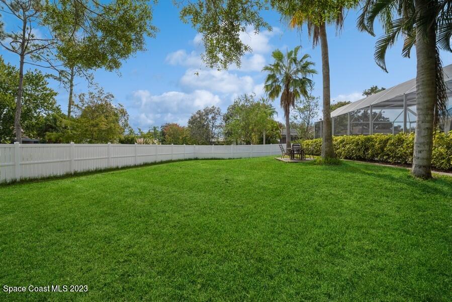 4395 Canard Road Melbourne, FL 32934 - Photo 34 of 36 a view of yard with grass and palm trees
