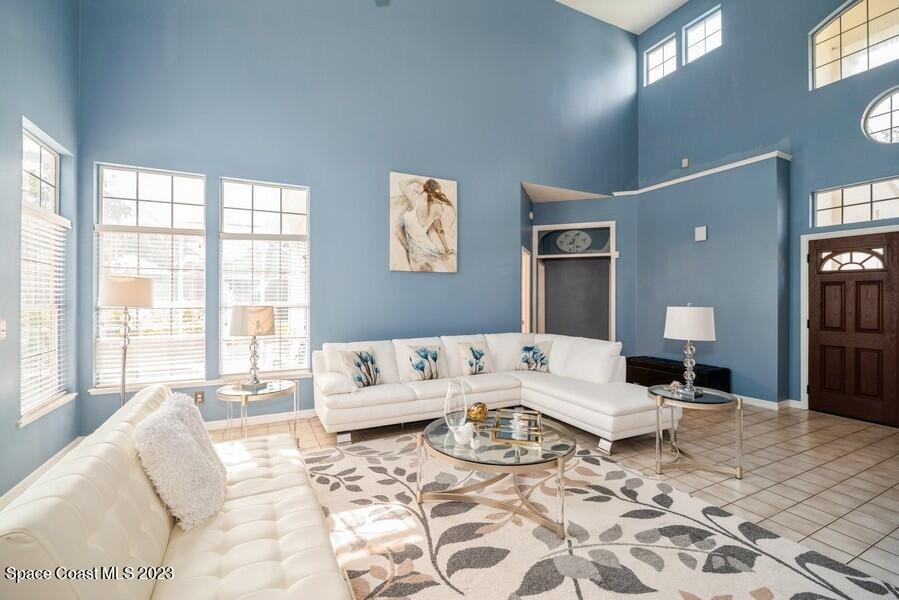 4395 Canard Road Melbourne, FL 32934 - Photo 5 of 36 a living room with a couch and a table