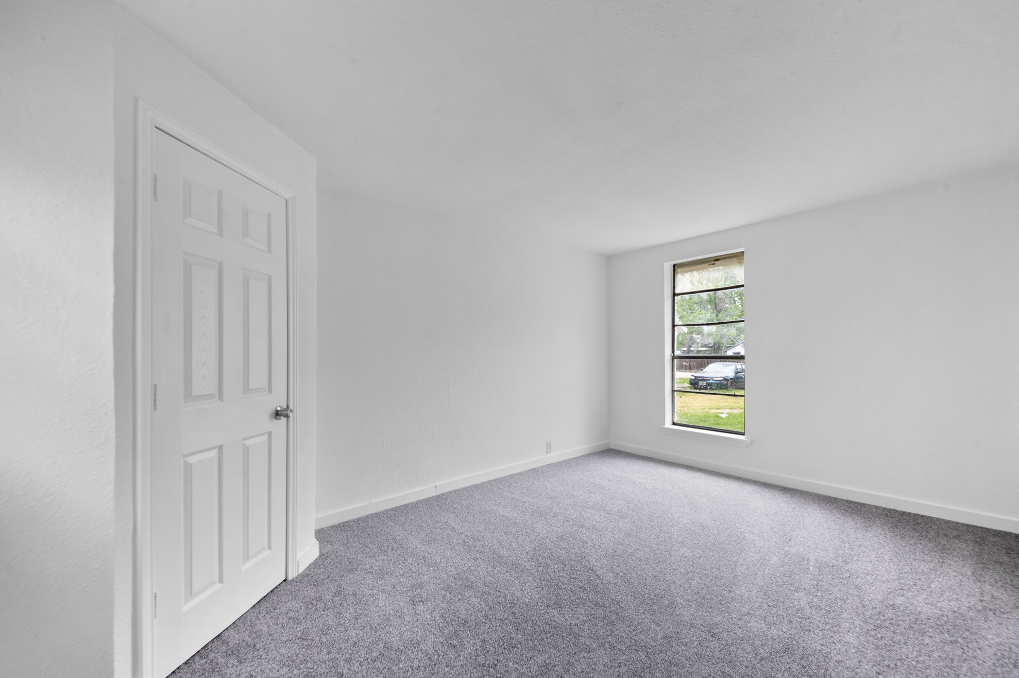806 East Emily Avenue, Unit 1 Wharton, TX 77488 - Photo 13 of 32 an empty room with windows