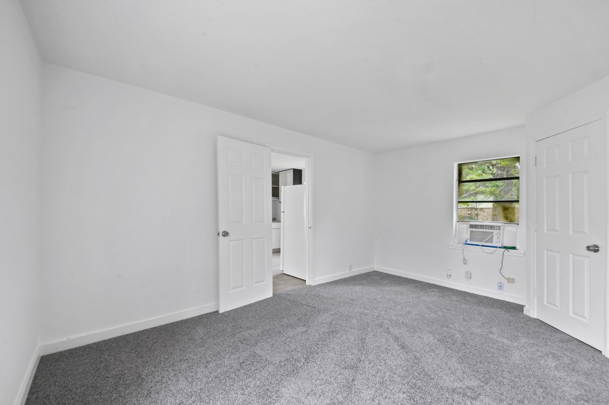 806 East Emily Avenue, Unit 1 Wharton, TX 77488 - Photo 16 of 32 an empty room with windows