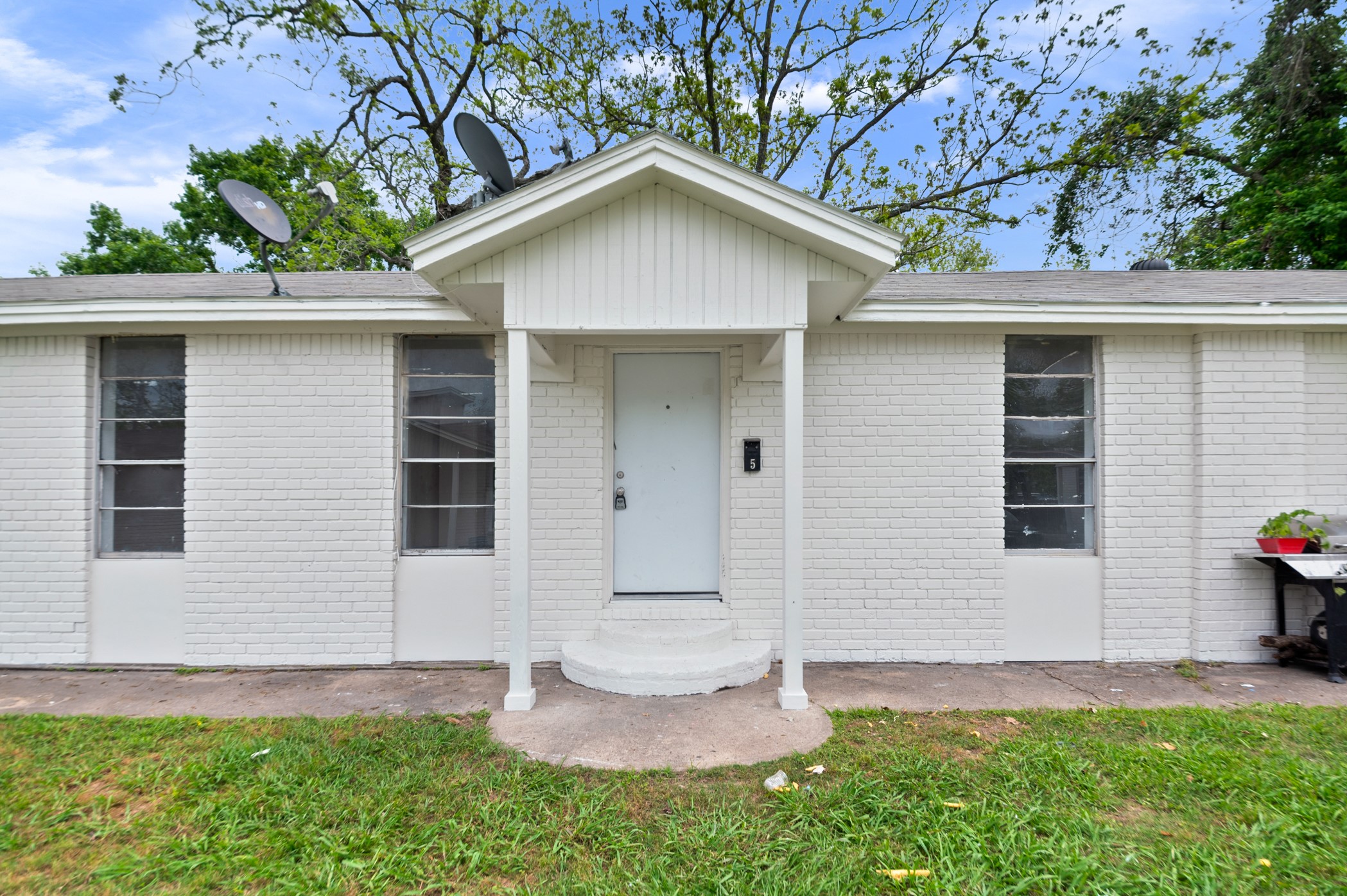 806 East Emily Avenue, Unit 1 Wharton, TX 77488 - Photo 18 of 32 a front view of a house with a yard