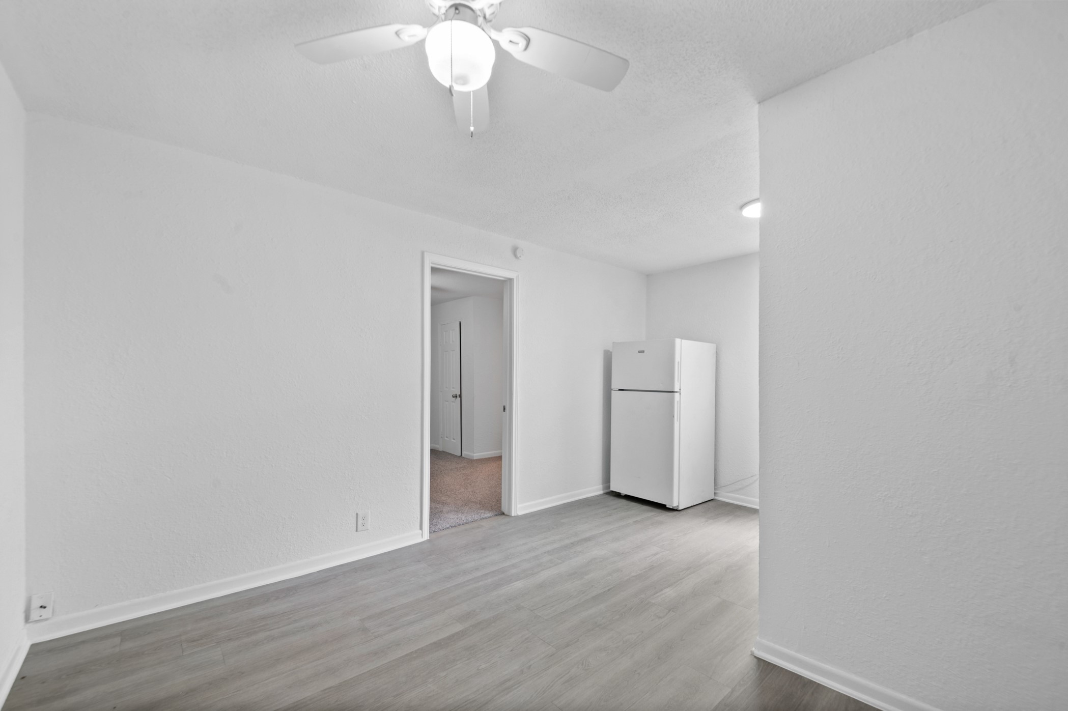 806 East Emily Avenue, Unit 1 Wharton, TX 77488 - Photo 20 of 32 a view of an empty room with wooden floor