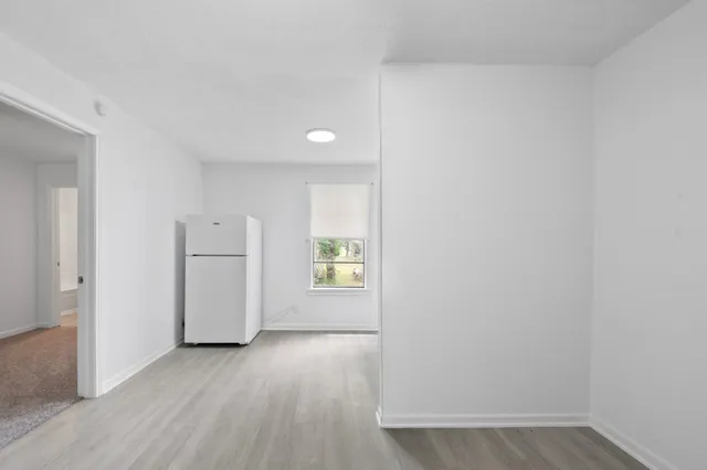 a view of an empty room and window